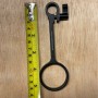 Trinity Cable Ring next to a tape measure, from the top